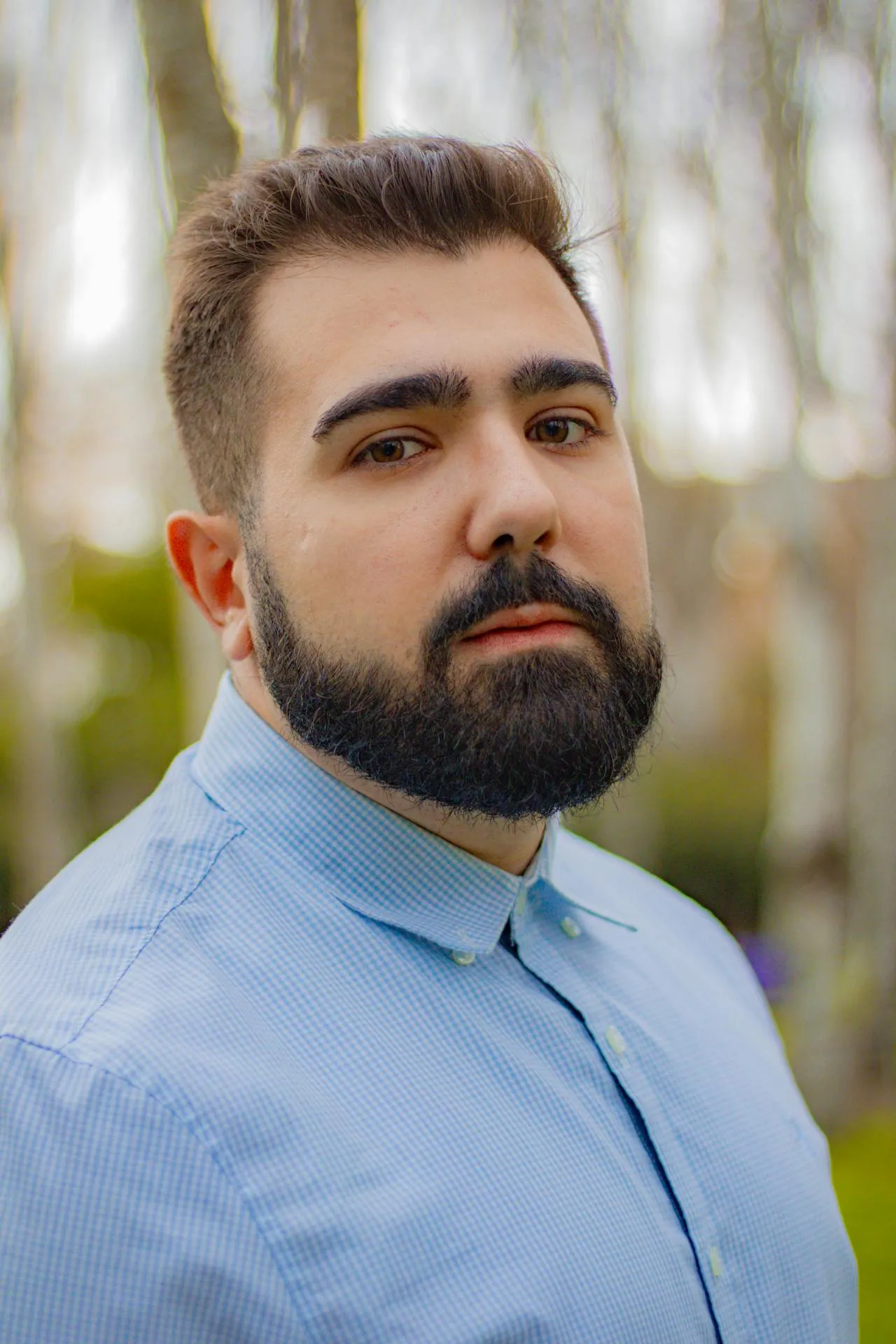 Professional portrait of male principal architect with glasses and suit